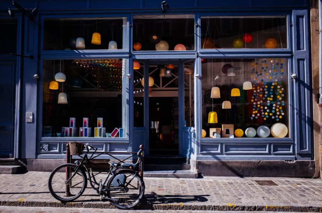 store front with bike in front of window
